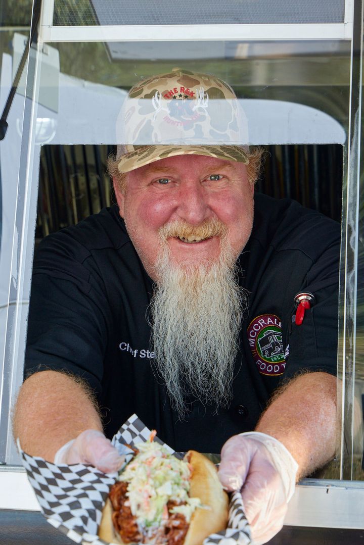 Chef Steve handing an order out the window